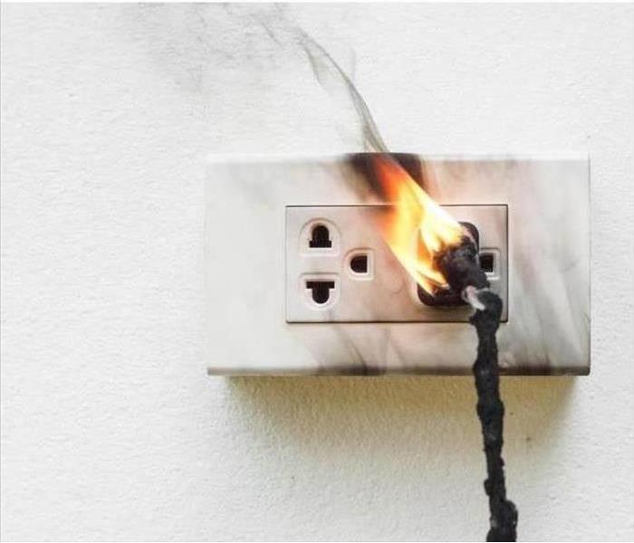 Electrical plug on fire.